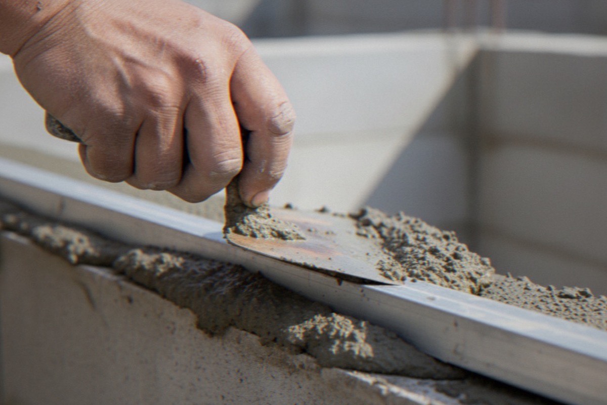 Masonry tools and mortar mixed to match historic Baltimore brickwork