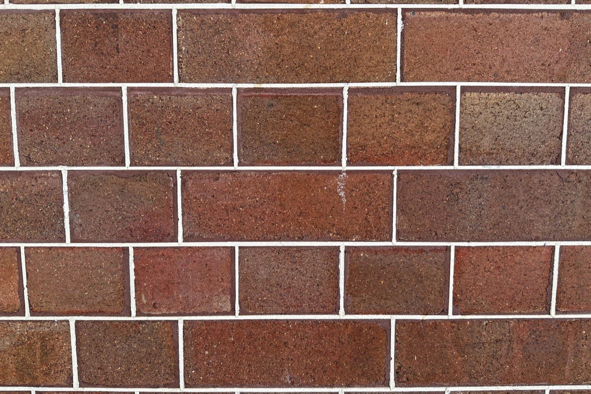 Mortar color and joint profile matched to original historic Baltimore brickwork