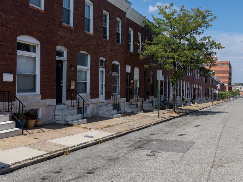 Restored white marble front steps on a Baltimore rowhouse