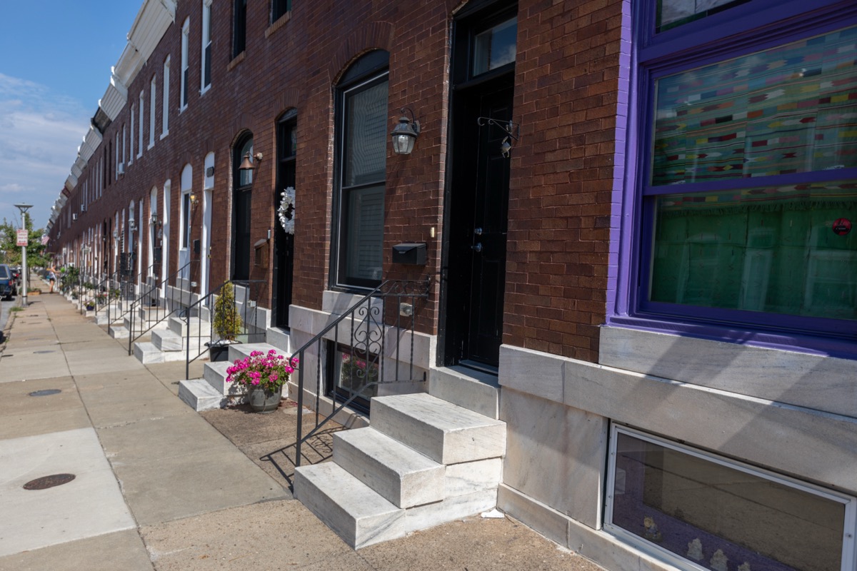 Restored white marble front steps on a Baltimore rowhouse